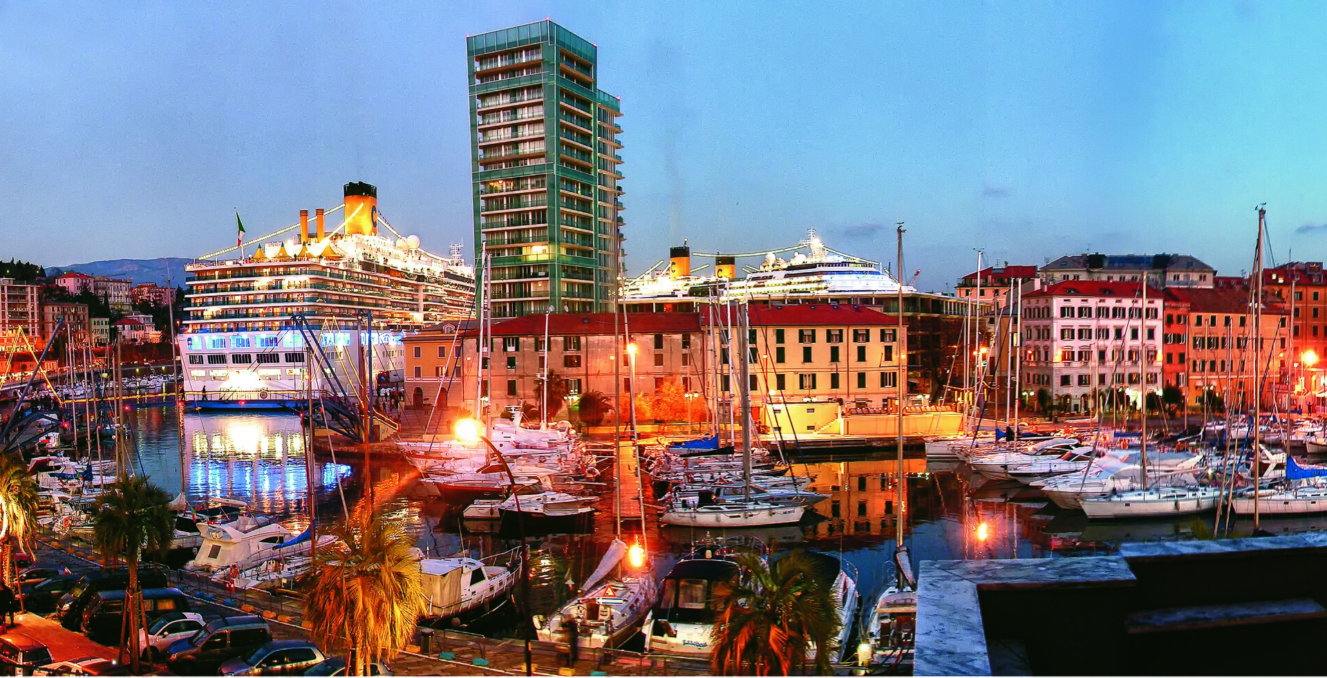 Port of Savona at sunset with a cruise ship and marina